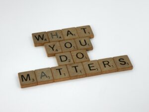 knowledge scrabble tiles spelling out 'what you do matters'
